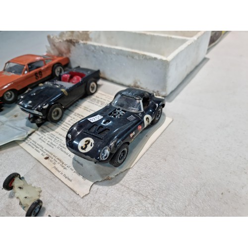 63 - Collection of slot car racing cars along with two boxes for slot cars inc a Revell model racer sting... 