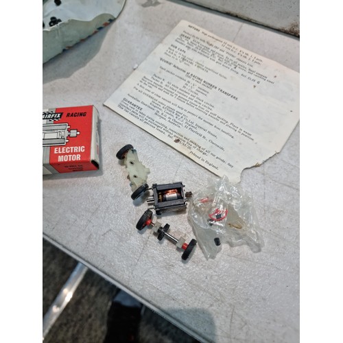 63 - Collection of slot car racing cars along with two boxes for slot cars inc a Revell model racer sting... 
