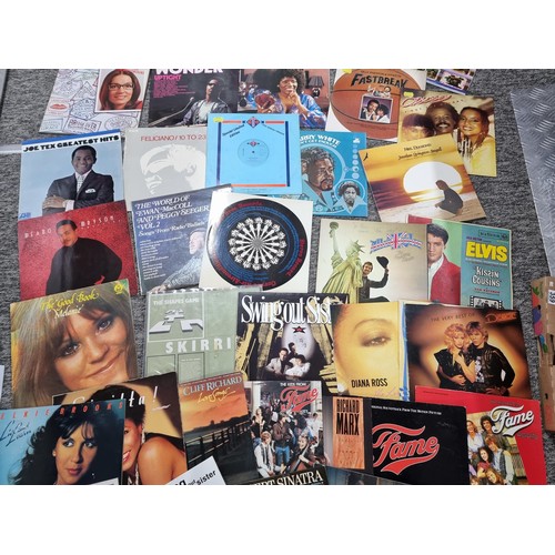 74 - Box containing a quantity of records inc Elvis, Stevie Wonder, Cliff Richard etc along with a select... 