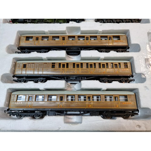 87 - Box containing a Flying Scotsman LNER 4772 locomotive and tender, spares and repair loose wire, 3 LN... 