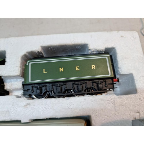 87 - Box containing a Flying Scotsman LNER 4772 locomotive and tender, spares and repair loose wire, 3 LN... 