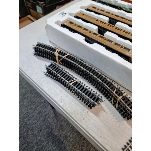 87 - Box containing a Flying Scotsman LNER 4772 locomotive and tender, spares and repair loose wire, 3 LN... 