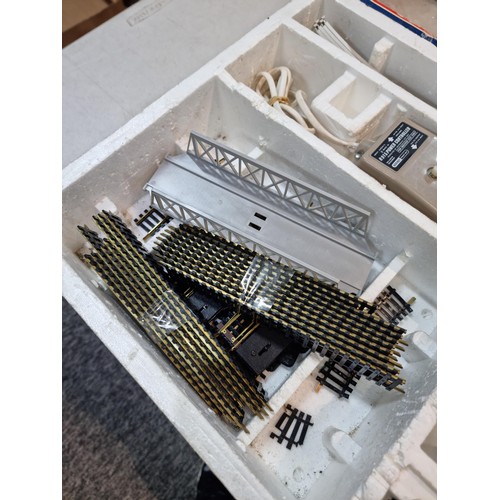 88 - Boxed Lima HO 1/87 electric train tack set, comes with an electric engine two coaches, power unit an... 