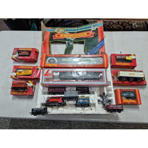 93 - Quantity of Hornby boxed train items inc a partially complete Hornby Junior electric train set, boxe... 