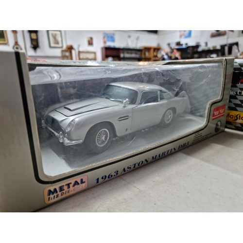101 - Collection of 3x diecast boxed cars inc Sun Star metal Aston Martin DB5 1/18 scale, a Maisto Mercede... 