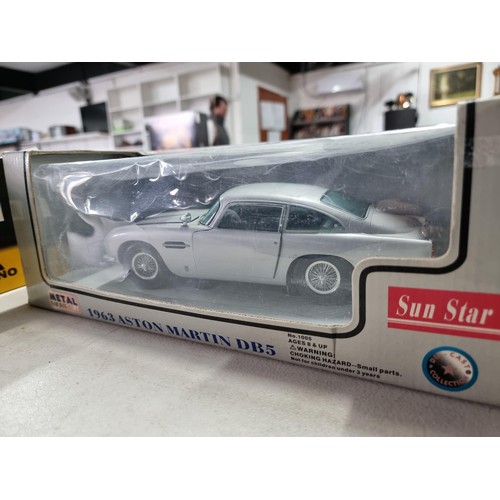 101 - Collection of 3x diecast boxed cars inc Sun Star metal Aston Martin DB5 1/18 scale, a Maisto Mercede... 