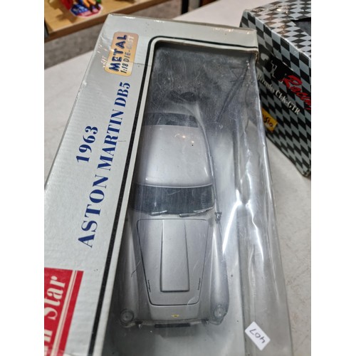 101 - Collection of 3x diecast boxed cars inc Sun Star metal Aston Martin DB5 1/18 scale, a Maisto Mercede... 