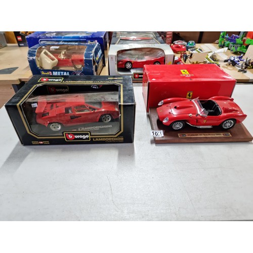 102 - A collection of 2 diecast boxed cars including a Burago Ferrari GTO 1984 on a wooden plinth along wi... 