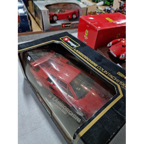 102 - A collection of 2 diecast boxed cars including a Burago Ferrari GTO 1984 on a wooden plinth along wi... 