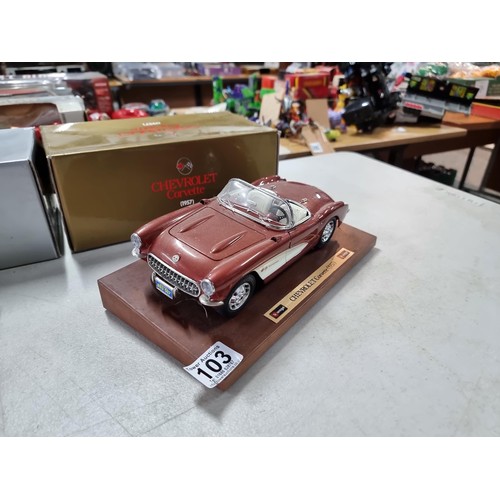103 - 2 boxed Burago diecast cars on wooden plinths including a Mercedes Benz SSK 1928 and a Chevrolet Cor... 