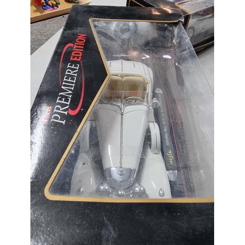 104 - 3 boxed Maisto boxed diecast vehicles including special edition Porsche boxter, a Mercedes Benz 280S... 