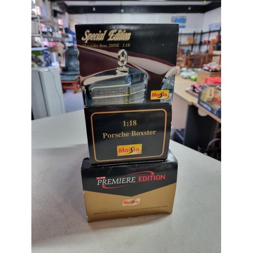 104 - 3 boxed Maisto boxed diecast vehicles including special edition Porsche boxter, a Mercedes Benz 280S... 