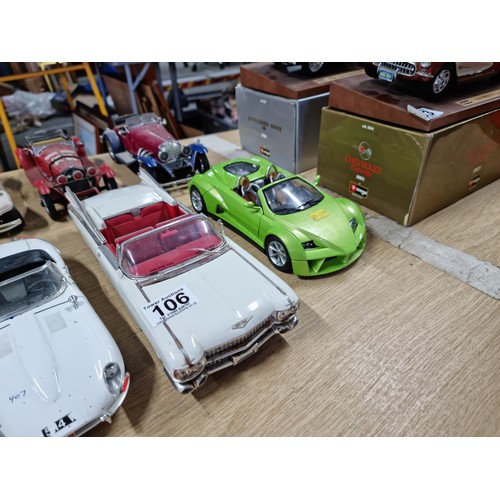 106 - A collection of 12 unboxed diecast cars including a Burago Giugiaro, a Maisto Cadillac 1959, a Burag... 