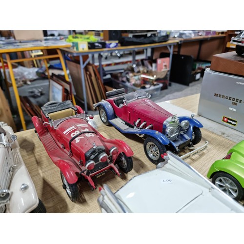 106 - A collection of 12 unboxed diecast cars including a Burago Giugiaro, a Maisto Cadillac 1959, a Burag... 
