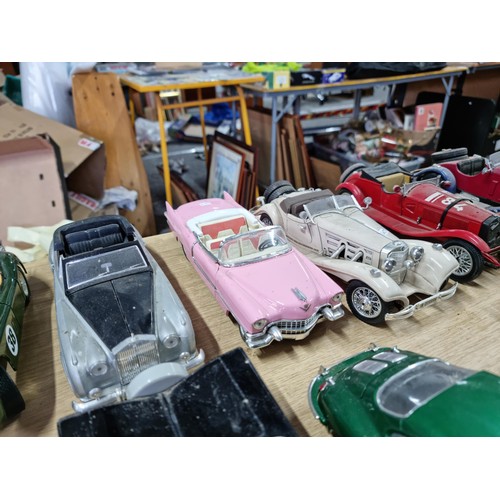106 - A collection of 12 unboxed diecast cars including a Burago Giugiaro, a Maisto Cadillac 1959, a Burag... 