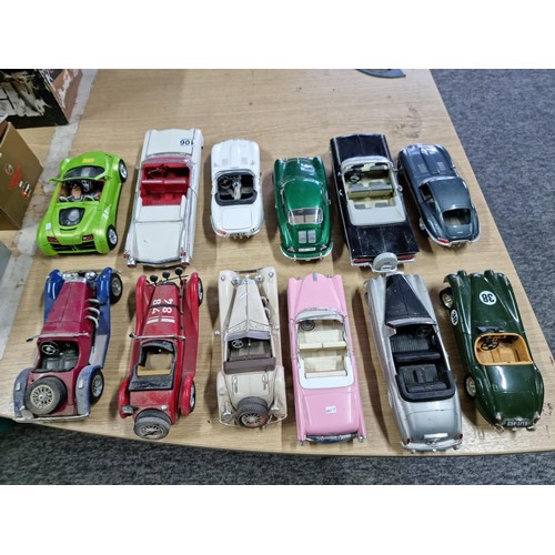 106 - A collection of 12 unboxed diecast cars including a Burago Giugiaro, a Maisto Cadillac 1959, a Burag... 