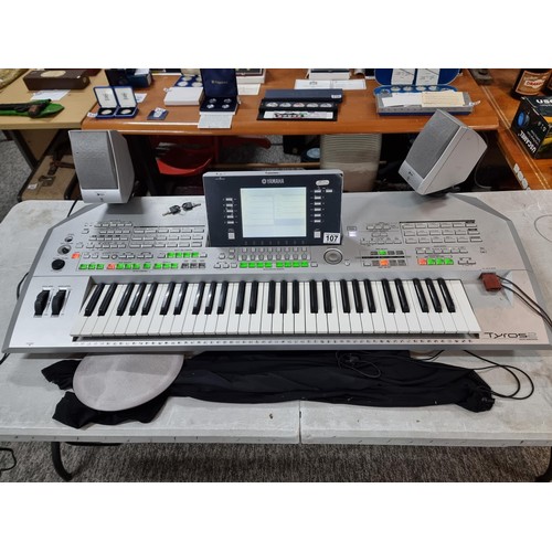 107 - A Yamaha Tyros II, 61 key workstation synthesizer/keyboard, includes its clip on speakers and workin... 