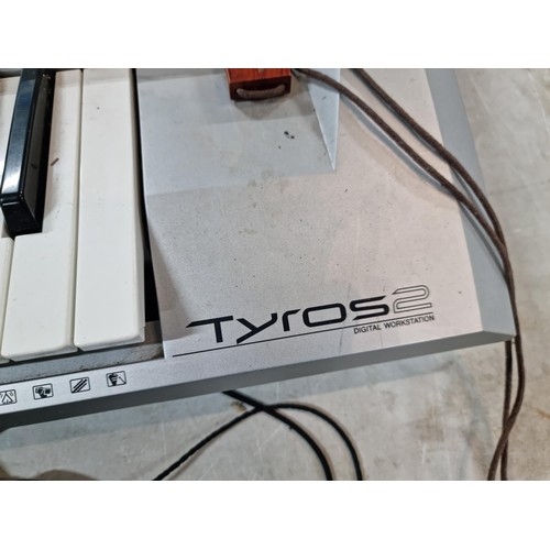 107 - A Yamaha Tyros II, 61 key workstation synthesizer/keyboard, includes its clip on speakers and workin... 