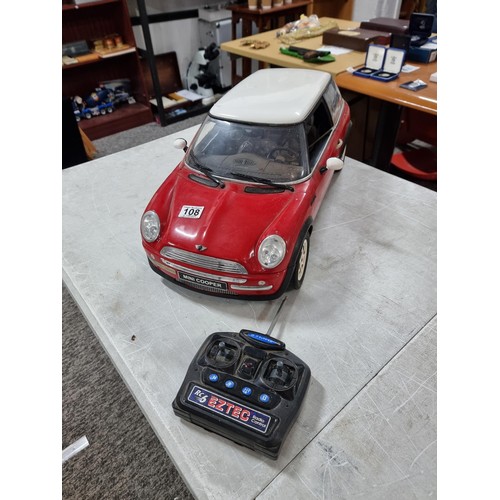 108 - very Large scale radio controlled mini cooper complete with handset complete with cable, measures 28... 