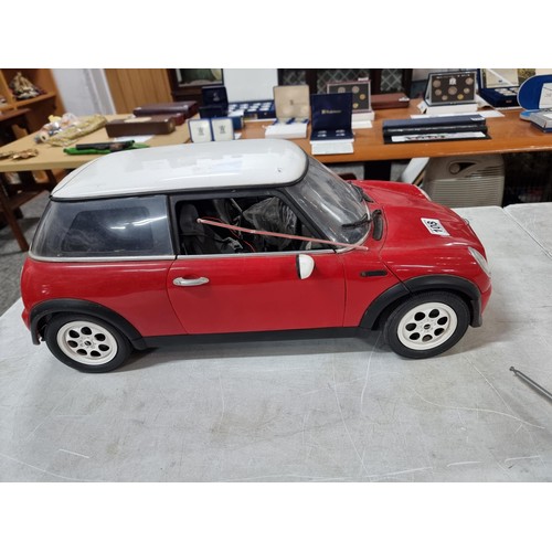 108 - very Large scale radio controlled mini cooper complete with handset complete with cable, measures 28... 