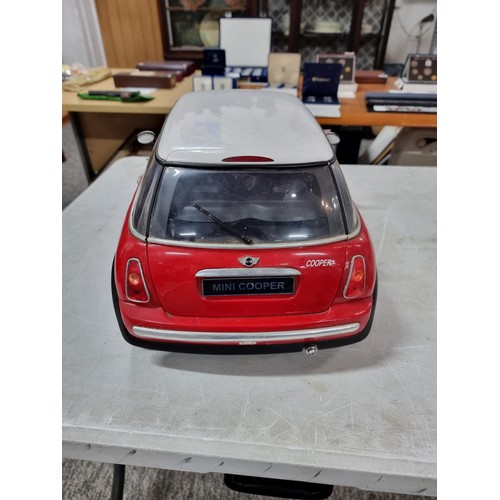 108 - very Large scale radio controlled mini cooper complete with handset complete with cable, measures 28... 