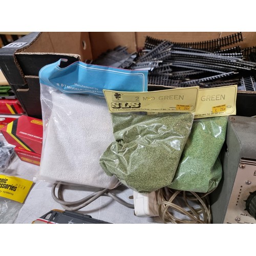 112 - Box containing a large quantity of model train 00 gauge  accesories inc a large quantity of track, s... 