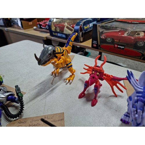 95 - A quantity of various collectable vintage action figures, some having a transforming action, to incl... 