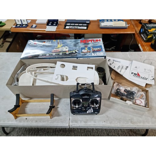 110 - Boxed Neptune model tug boat partially complete, with a quantity of parts and a controller, cannot g... 