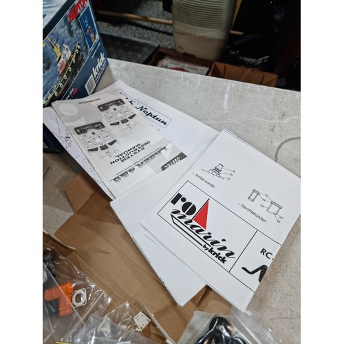 110 - Boxed Neptune model tug boat partially complete, with a quantity of parts and a controller, cannot g... 