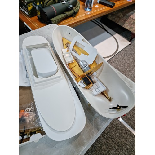 110 - Boxed Neptune model tug boat partially complete, with a quantity of parts and a controller, cannot g... 