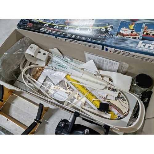 110 - Boxed Neptune model tug boat partially complete, with a quantity of parts and a controller, cannot g... 