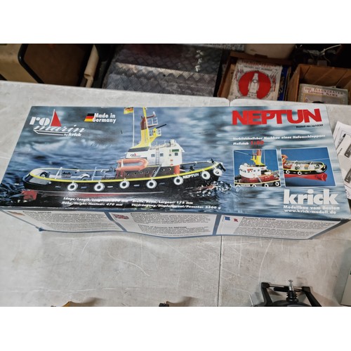 110 - Boxed Neptune model tug boat partially complete, with a quantity of parts and a controller, cannot g... 