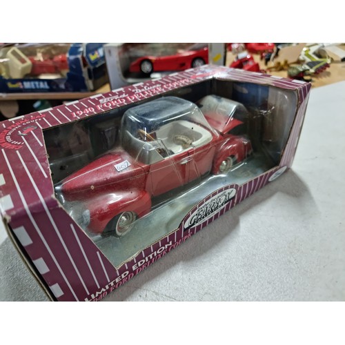 105 - A collection of 4x rare chain driven heavy diecast cars by Gearbox Collectibles, including a boxed 1... 