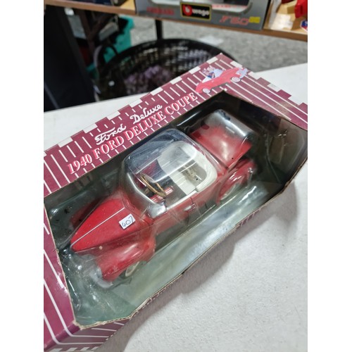 105 - A collection of 4x rare chain driven heavy diecast cars by Gearbox Collectibles, including a boxed 1... 