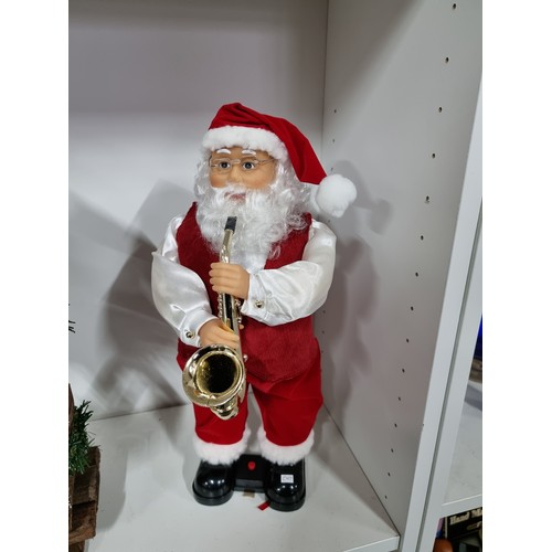 4 - 3x Christmas items inc a dancing Father Christmas with a saxophone along with a tall Father Christma... 