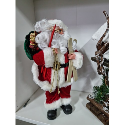 4 - 3x Christmas items inc a dancing Father Christmas with a saxophone along with a tall Father Christma... 