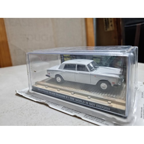 68 - A collection of James Bond related diecast vehicles to include 2x loose Corgi Aston Martin DB5's of ... 