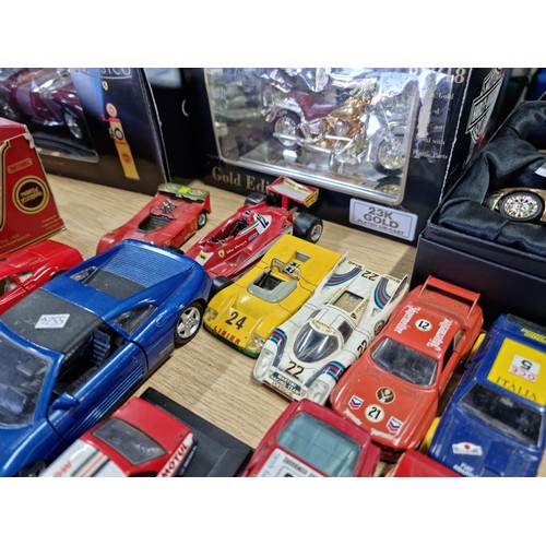 106 - A large collection of 18x various diecast model cars, mostly of racing sports cars by various makers... 