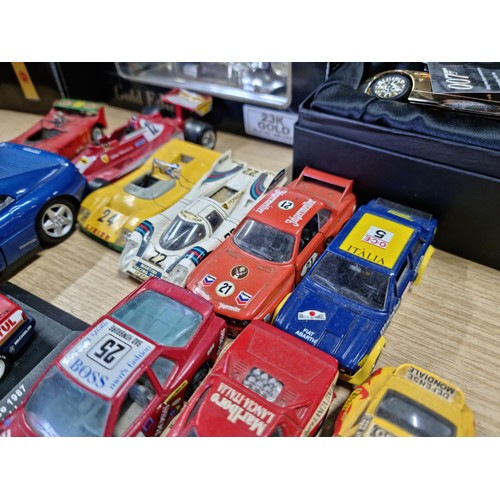 106 - A large collection of 18x various diecast model cars, mostly of racing sports cars by various makers... 