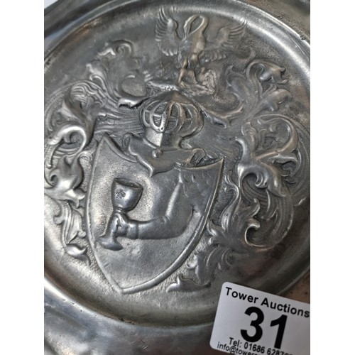 31 - A vintage Rein Zinn pewter plate with an embossed coat or arms, in good overall condition. Has a dia... 