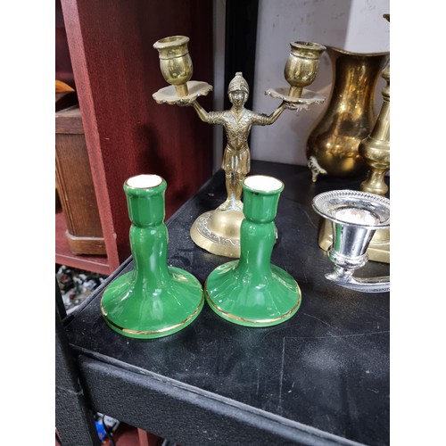 46 - A large quantity of metalware to include 4 pairs of brass candlesticks, 2 chrome silver plated cande... 