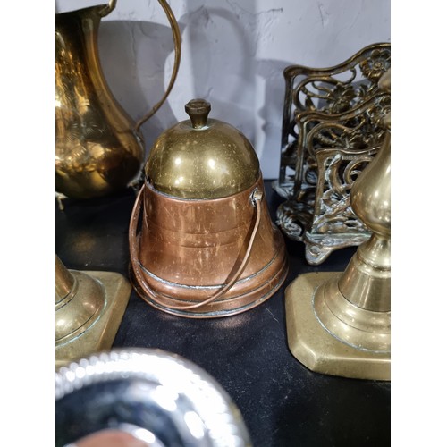 46 - A large quantity of metalware to include 4 pairs of brass candlesticks, 2 chrome silver plated cande... 