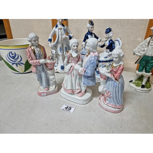 49 - A collection of 6 porcelain figures along with a good quality tall conical glazed vase in brown and ... 