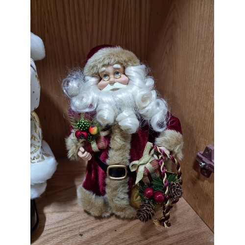 53 - A collection of 3x Santa figures, 2 which are battery operated. All in good order, tallest figure ha... 