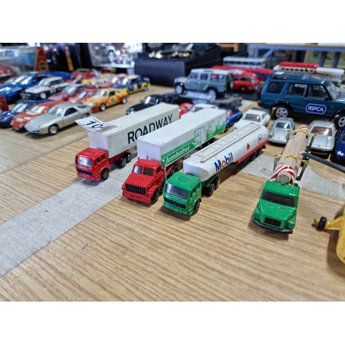 104 - A large collection of approx 42 diecast model vehicles of various makes which includes a collection ... 