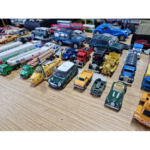 104 - A large collection of approx 42 diecast model vehicles of various makes which includes a collection ... 