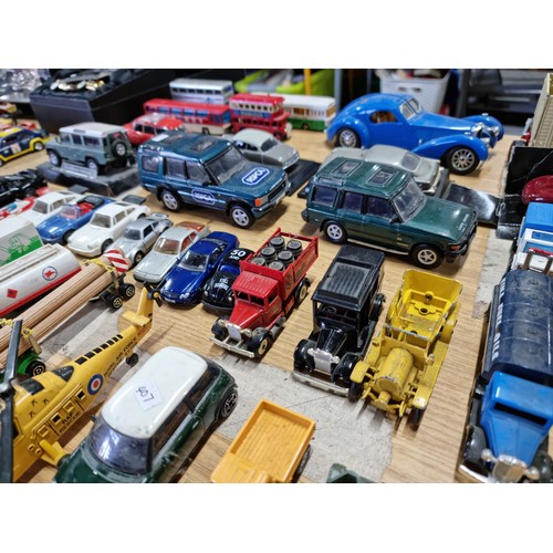 104 - A large collection of approx 42 diecast model vehicles of various makes which includes a collection ... 