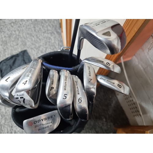 57 - A comprehensive golf club and bag set to include 9 irons By Wilson Staff, Odyssey, Rossie II putter ... 