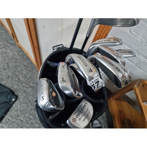 57 - A comprehensive golf club and bag set to include 9 irons By Wilson Staff, Odyssey, Rossie II putter ... 