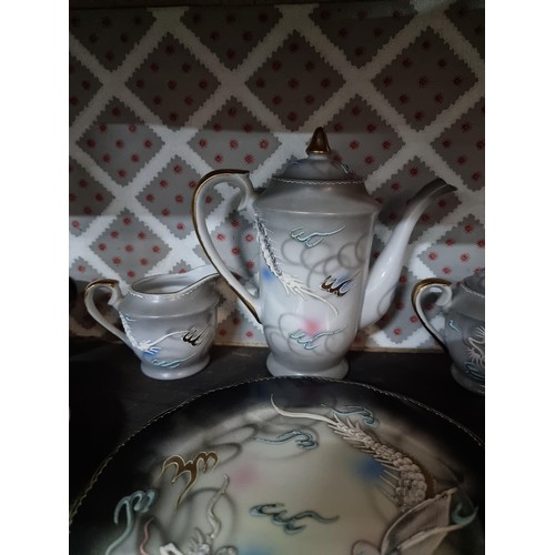 1 - A collection of 4x part oriental tea sets including a mother of pearl lustre tea set, a dragon desig... 